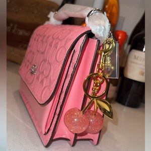 Klare Crossbody in signature patent leather with Cherry charm 🍒